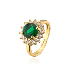 Detailed macro view of the gold-plated floral ring with a green oval gemstone and zircons