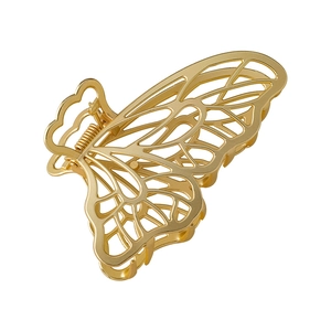 Golden matte butterfly hair claw clip with hollow wing design for thick hair styling