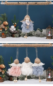 Detailed view of plush Christmas angel pendants in pink, white, and blue with wings