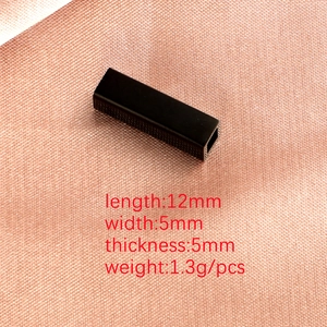 Macro shot of 12mm black titanium steel hollow rectangular tube for DIY jewelry making