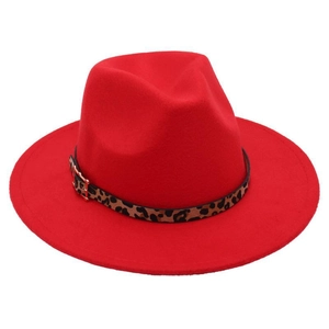 Detail of red wide-brimmed wool fedora with leopard print band and golden buckle