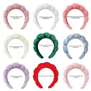Grid view of velvet padded headbands in nine colors including pink, green, and blue