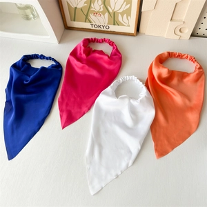 Flat lay of colorful satin elastic headwraps in blue, rose red, white and orange