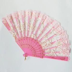 Detailed view of pink lace folding fan with gold rose embroidery and plastic ribs