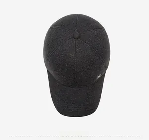 Detailed top view showing dark grey textured wool blend baseball cap with side logo