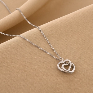 Polished S925 sterling silver interlocking double heart necklace with pavé zircon accents