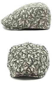 Detail of vintage ivy cap featuring black and grey leaf pattern and textured fabric
