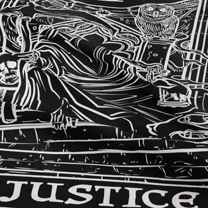 Detail of bohemian black tapestry fabric showing the Justice tarot card white print texture