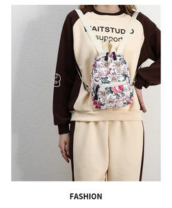 Detail of floral mini backpack with adjustable straps and high-quality stitching detail