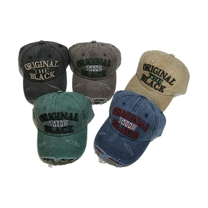 Five colors of vintage washed cotton baseball caps with distressed holes and embroidery