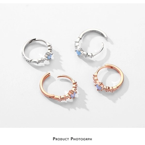 Close-up of S925 sterling silver hoop earrings with blue opal and white cubic zirconia