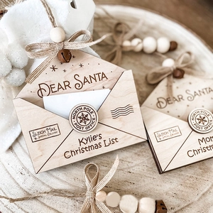 Laser-cut wooden Christmas envelope ornament with burlap bow and rustic bell detail