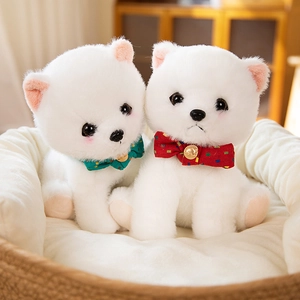 Adorable white Pomeranian plush puppy dolls sitting in a basket with plaid bow ties