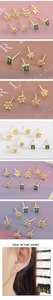 Macro shot of gold zircon earrings featuring floral and star shapes with model wearing view