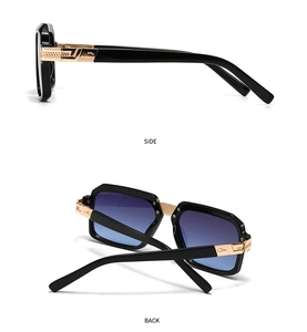 Detail of vintage square sunglasses with blue gradient lenses and golden hinge texture