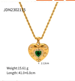 Detail of a gold heart pendant with green gemstone and twisting chain with dimensions