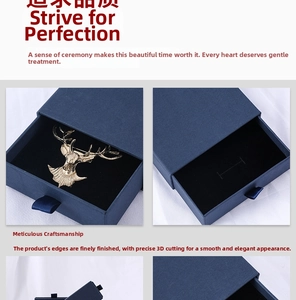 Macro view of blue drawer gift box and golden deer head brooch with satin ribbon pull