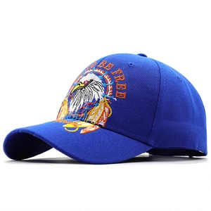 Detailed close-up of eagle embroidery and Born to be Free text on a navy cotton baseball cap