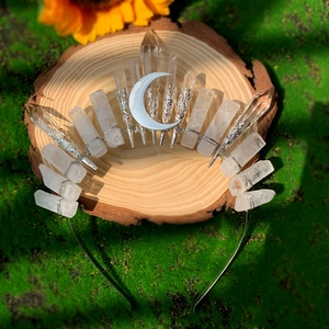 Detailed view of raw white crystals and silver moon accent on a handmade crown headband