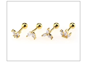 Detailed view of four gold-plated ear studs featuring clear marquise-cut zircons and screw backs