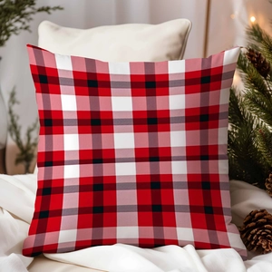 Close-up of red and white plaid Christmas pillowcase in a cozy holiday home setting
