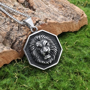 Silver stainless steel hexagon lion head pendant necklace on a natural wood background