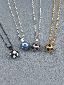Detail view of soccer ball pendants in black, blue, silver and gold with matching chains