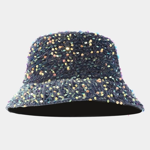 Detail shot of colorful metallic sequins on a deep blue bucket hat with shiny finish