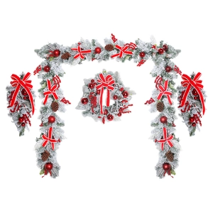 Flocked Christmas wreath and garland set with red bows, berries and pine cones on white