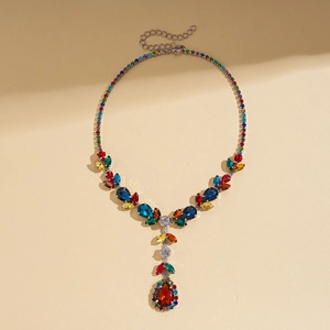Detail of colorful waterdrop gemstones on a silver luxury statement necklace