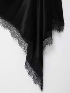 Close-up of black silk velvet fabric with exquisite eyelash lace trim detailing