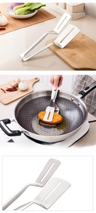 Detail view of hollowed stainless steel grill tong for easy oil filtration and flipping