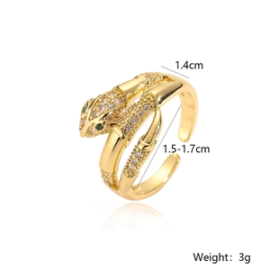 Detailed close-up of gold snake ring with green stone eyes and white zircon stones