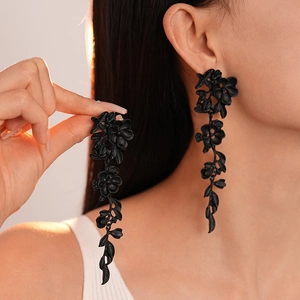Elegant matte black floral drop earrings with leaf tassel design for a vintage aesthetic