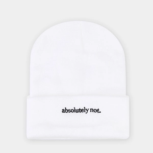 Detailed close-up of white ribbed knit beanie with black absolutely not. embroidery