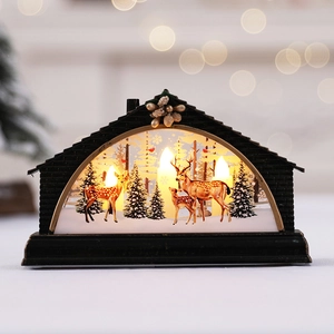 Lighted Christmas cabin decoration with reindeer and pine forest scene for holiday decor