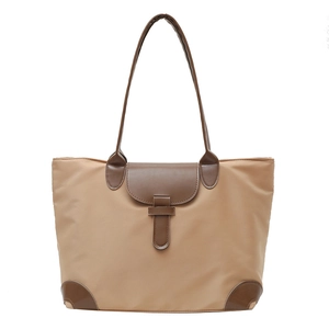 Lightweight khaki nylon tote bag with brown leather handles and color-block trim