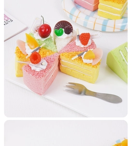 Macro shot of colorful squishy mousse cake slices with fruit toppings on a white tray