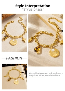 Detail view of gold stainless steel sun moon and leopard print charms on vintage bracelet
