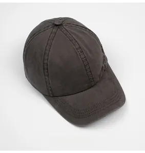 Top view of a six-panel washed cotton baseball cap in dark brown with curved brim detail