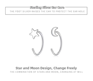 Detailed view of sterling silver crescent moon and star hoop earrings in silver