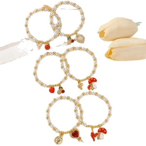 Chic beaded bracelet set with pearls, golden beads, cherry and heart enamel charms