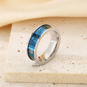 Macro detail of silver ring with blue inlay and The only engraving on a stone surface