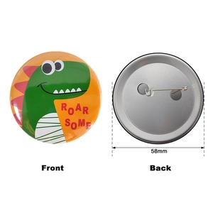 Front and back detail of 58mm green dinosaur tinplate badge with ROAR SOME text