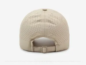 Detail of breathable laser-cut holes and adjustable back strap on the beige baseball cap