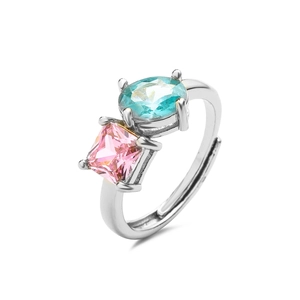 Detail of adjustable silver ring with oval light blue and square pink cubic zirconia stones