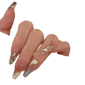 Handmade long trapezoid press-on nails with nude pink, blue marble, and rhinestone accents