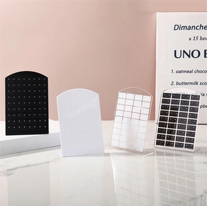 Three-color arched acrylic earring display stands in black, white, and transparent finish