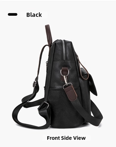 Side view of black faux leather backpack showing pebbled texture and brown strap accents