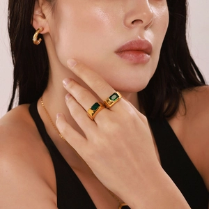 Exaggerated 18k gold plated stainless steel ring with rectangular green zircon gemstone